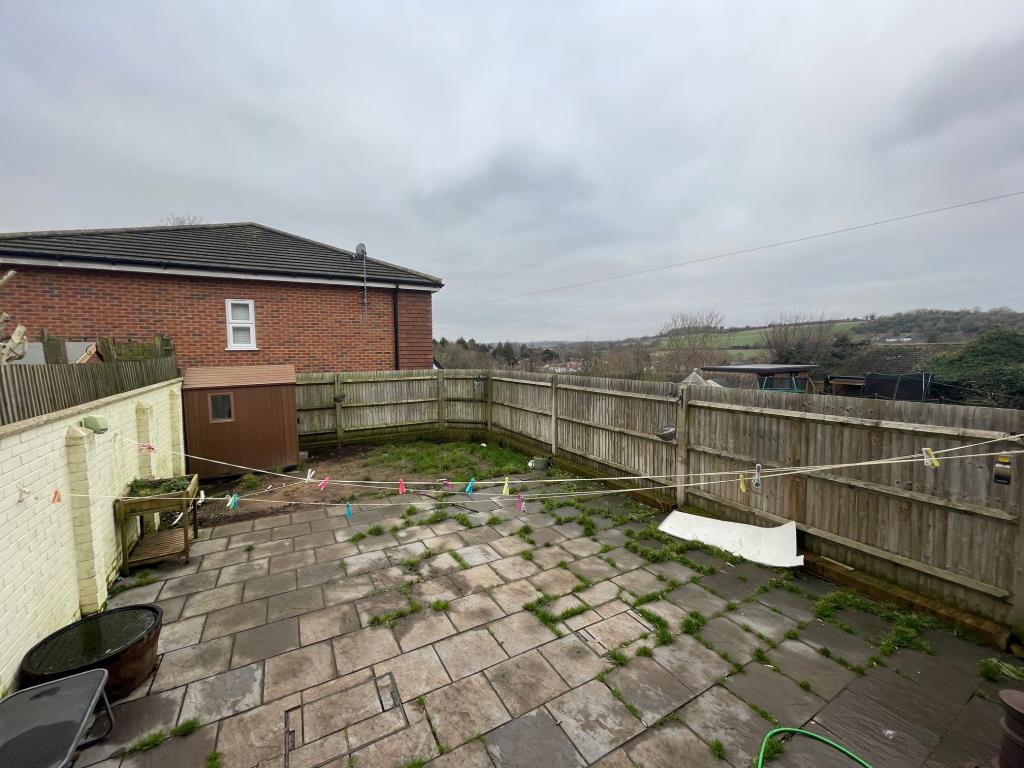 Lot: 3 - THREE-BEDROOM HOUSE IN POPULAR LOCATION - Rear gardend and view to the back of the house